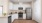 a kitchen with white cabinets