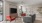 a living room with a tv and chairs