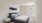 a bedroom with a bed and a lamp