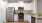 a kitchen with white cabinets